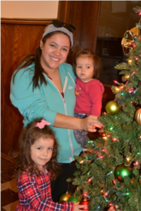 Bree, Addie and Josie Thatcher decking Old Main for Christmas