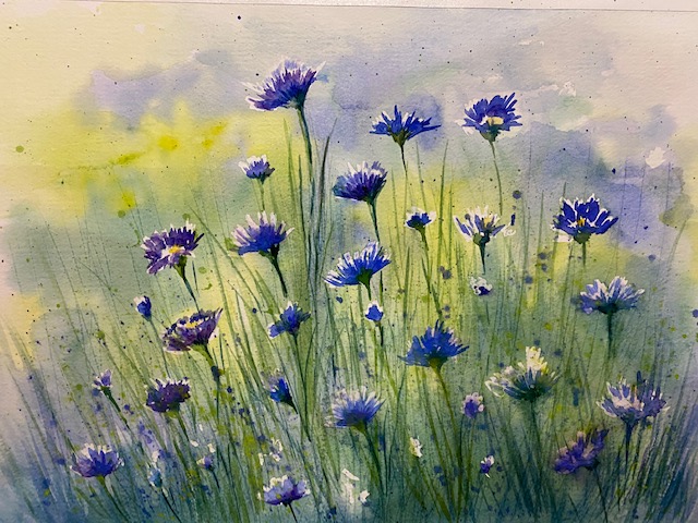 Watercolor painting of blue flowers.