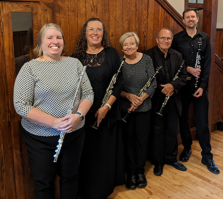 Photo of the musicians in Winds of Winona with their instruments.