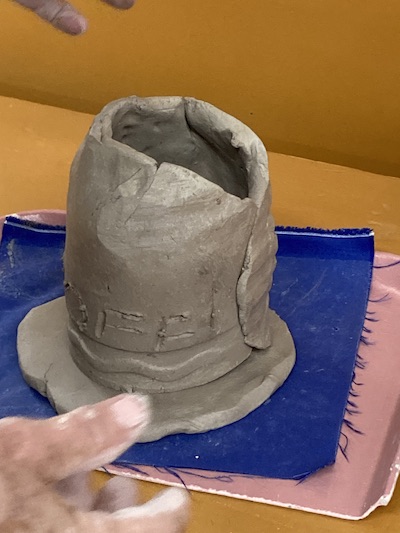 A soft slab pottery vessel.