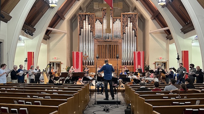 Photo of an orchestra and choir performing at Central Lutheran Church.