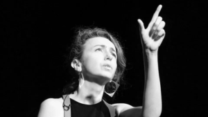 Black-and-white photo of storyteller Clare Murphy performing.