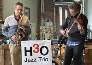 Winona Symphony Orchestra conductor Dr. Erik Rohde (violin) jams with WSO board member Aaron Lohmeyer on alto sax at the February Jazz Jam.