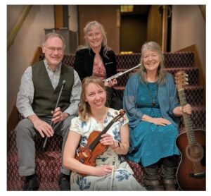 Photo of the band members of Patina seated with their instruments.