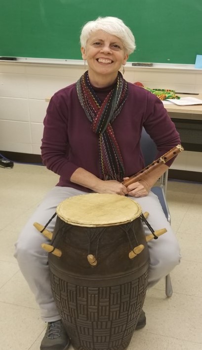 Photo of Dr. Colleen Haas with a drum.