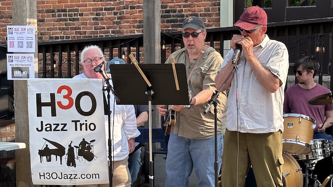 A Winona trio – Margaret Cassidy, Tom Nalli, and John Carrier jamming with H3O in May.