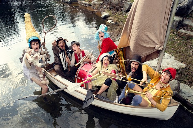 Photo of FLOTSAM! River Circus performers in a boat.