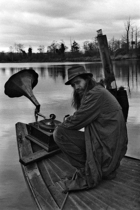 Black-and-white photo of Jason Webley on a boat.