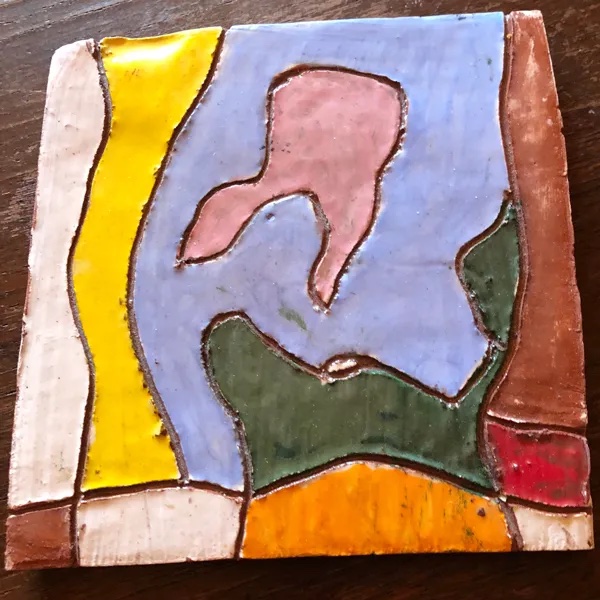 Photo of a decorated ceramic tile.
