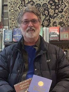 Photo of Merle Hanson with books.