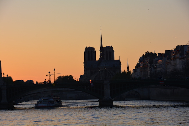 Photo of the Notre Dame Cathedral from the River Seine in Paris.