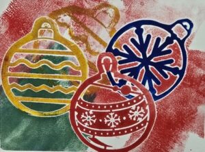 Monoprinted card featuring colorful holiday ornaments.