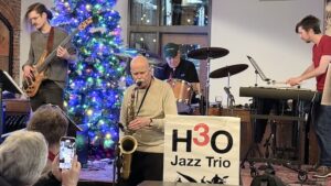 Local jazz legend John Paulson jams with H3O in December.