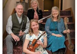 Photo of the band members of Patina seated with their instruments.