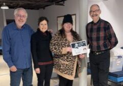 BellaMusica singer Lauren Mechell, Central’s Director of Worship, Music & Arts A. Eric Heukeshoven, Warming Center staff Jennifer Elesson, and Messiah music director Dr. Harry Mechell exchange a donation for the Warming Center from the Messiah Sing-in.
