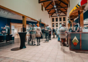 Photo by Bailey Tillman of a New Look Party taking place in the atrium at the Minnesota Marine Art Museum.