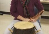 Photo of Dr. Colleen Haas with a drum.