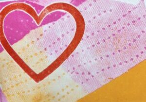 Image of a monoprinted card in red, pink and orange with a heart shape.