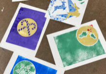 Photo of several colorful, holiday-themed monoprints.