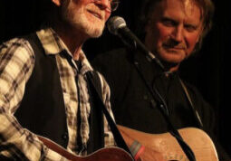 Photo of Johnsmith & Dan Sebranek performing with guitars.