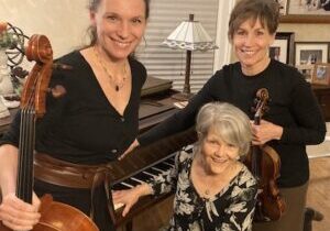 Photo of the members of the Wabasha Street Trio with their instruments.