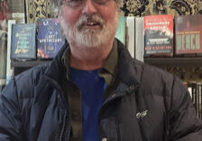 Photo of Merle Hanson with books.